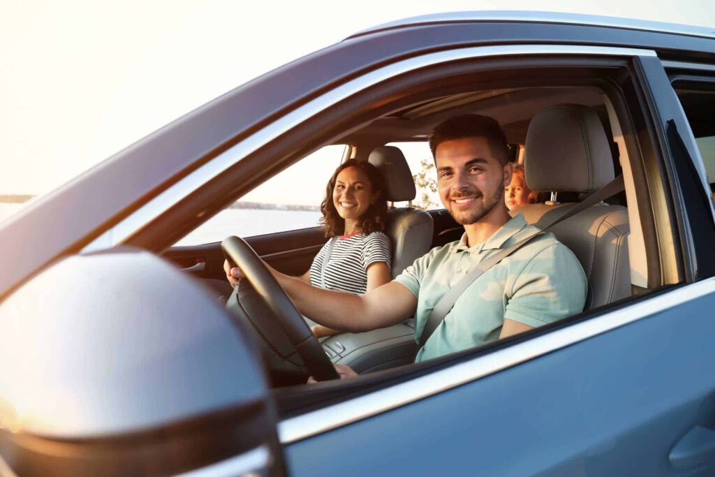 Couple driving in their car